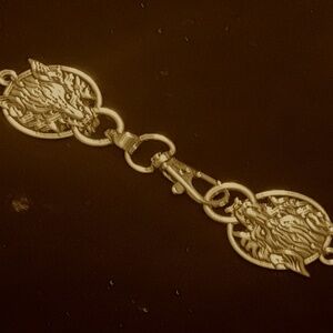 wolf cloak clasp in gold
